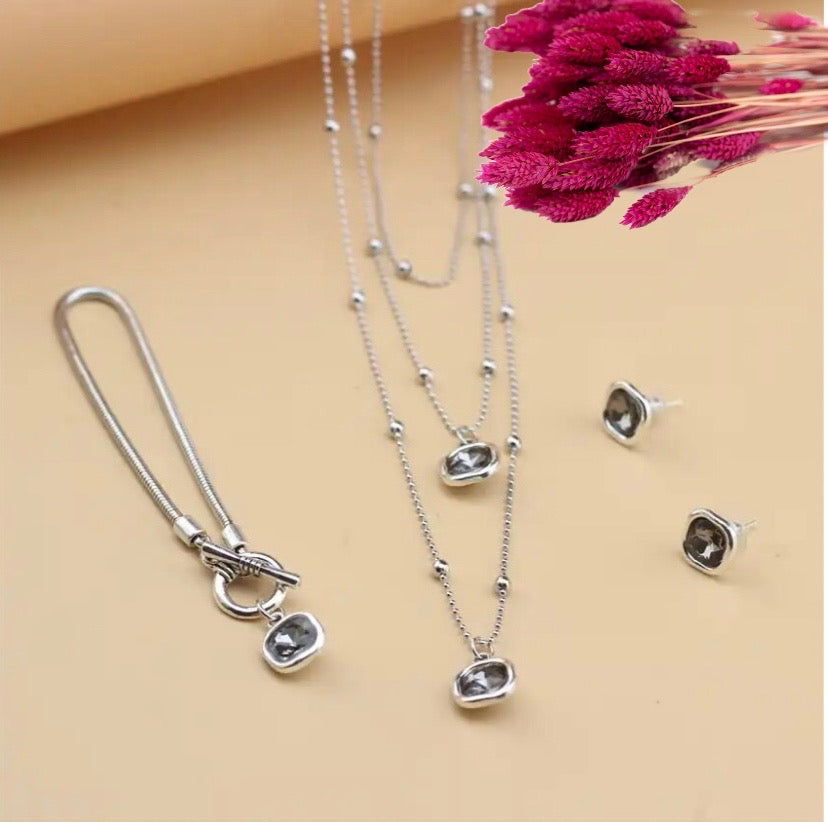 BALANCE bracciale con charms cristalli irregolari